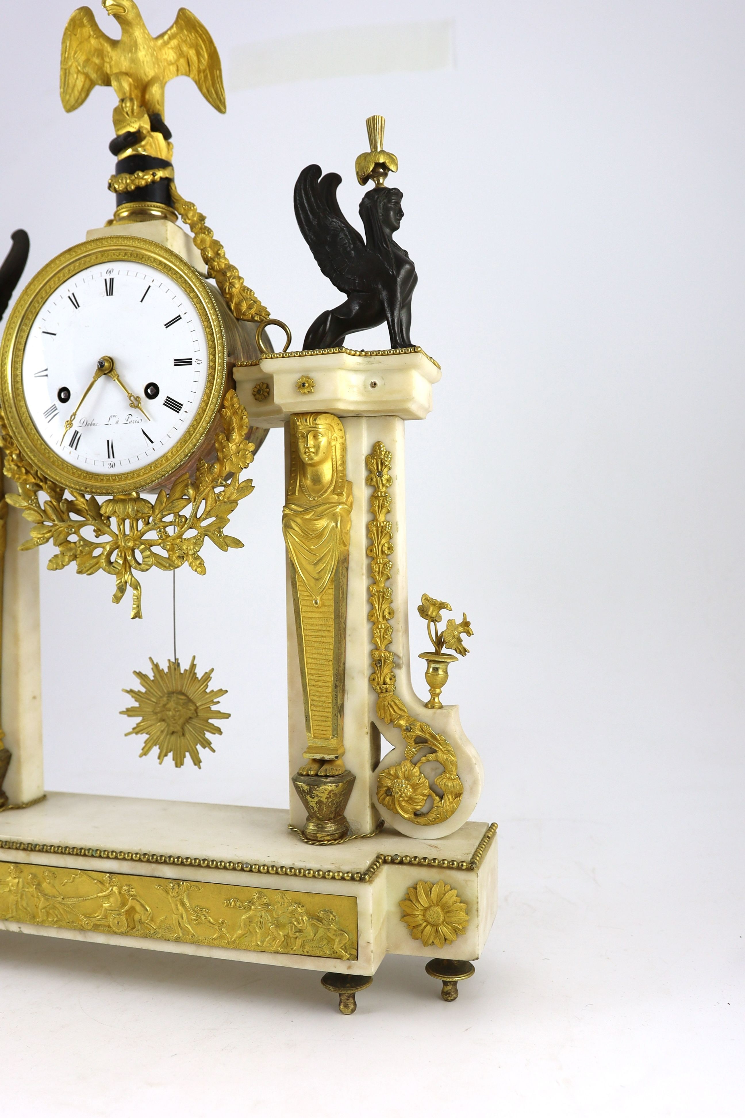 Jean Baptiste Dubuc L'ne à Paris. A Louis XVI bronze and ormolu mounted white marble mantel clock, width 43cm, depth 11cm, height 60cm